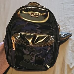 Guess Black and Gold Backpack with Metallic Accents